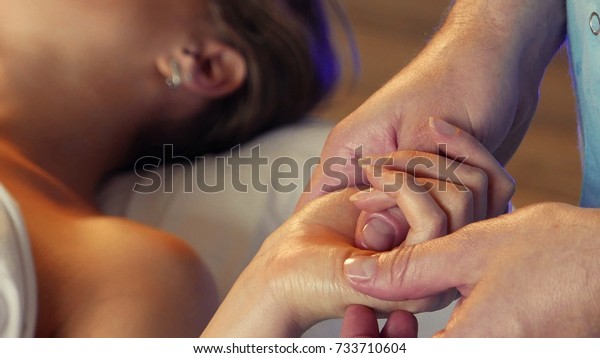 Massage of\
the palm of the hand and wrist. The foreground. \
Remove tension\
and fatigue. Lubricated with oil.  Stroking and rubbing your\
fingers. Relaxing technique of hand\
movements.