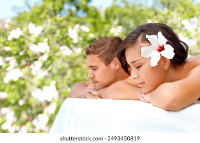 Massage, peace and couple at outdoor spa for skincare, health or relax for wellness on table. Calm, man and woman at luxury salon with hibiscus flower in nature for beauty therapy on holiday together - Powered by Shutterstock