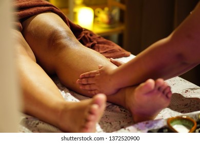 Massage And Scrub With Salt And Milk At The Legs.