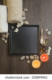 Massage Spa Centre Table Top Shot. Pebble Stone Stacked On Table.