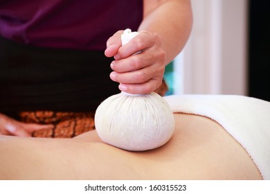  massage with spa herbal compress balls  - Shutterstock ID 160315523