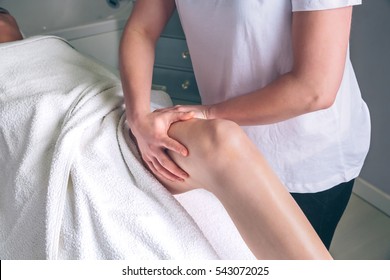 Massage Therapist Hands Doing Lymphatic Drainage Treatment To Woman