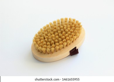 Massage Wooden Soft Body Brush With A Natural Nap, Is Worn On The Arm, On A White Background, Used In The Shower For Washing The Body