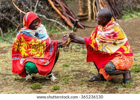 Massai men shaking hand concluding an agreement