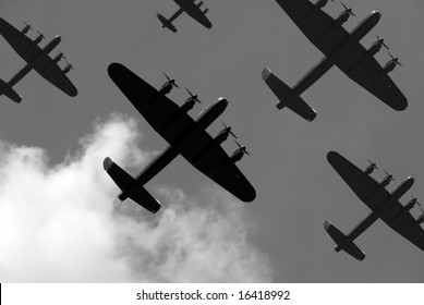 A massed formation of British Lancaster bombers flying overhead.