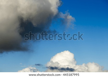 Masses of  majestic white fluffy cumulus  congestus or towering cumulus ice cream  clouds in a blue Australian sky in mid winter  are a portender of thunderstorm activity  likely to eventuate.