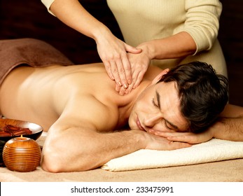 Masseur Doing Massage On Man Body In The Spa Salon. Beauty Treatment Concept.