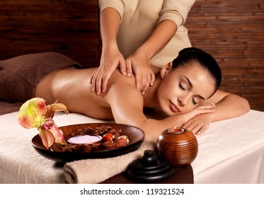 Masseur Doing Massage On Woman Body In The Spa Salon. Beauty Treatment Concept.