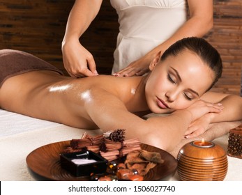 Masseur Doing Massage On Woman Body In The Spa Salon. Beauty Treatment Concept.