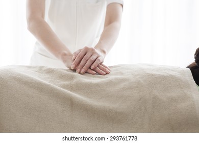 Masseur doing massage on woman back in the spa salon - Shutterstock ID 293761778