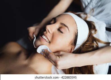 Masseur giving treatment to beautiful brunette - Shutterstock ID 422883595