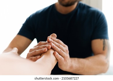 Masseur Man During Integrative Medicine Treatment - Female Foot Massage