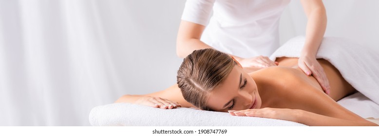 Masseur Massaging Pleased Young Woman On Massage Table In Spa Salon, Banner