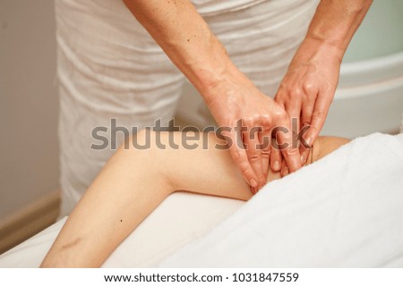 Similar – Hands massaging female abdomen.