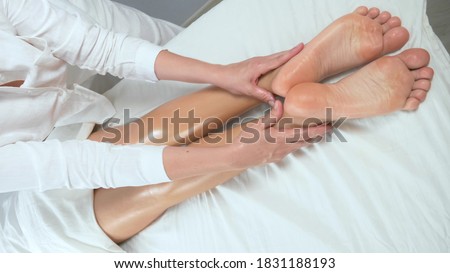 Similar – Hands massaging female abdomen.