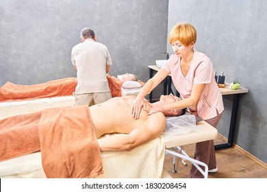 Masseuse Woman Doing Upper Body Massage To Man