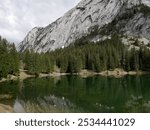 Massif of Bargy and lac Benit near Cluses in Haute Savoie, alpine lake and forest in French alps