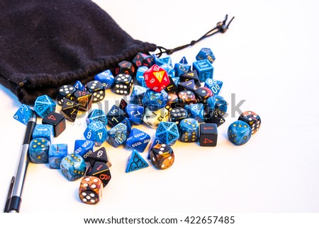 Massive amount of dice on a table, representing the moment of gathering your dice for the game thats about to start. The purpose is to visualize traditional board games and roleplaying games.
