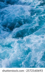 The massive amount of glacial water surging down the river causes a tumultuous flow through the gorge.