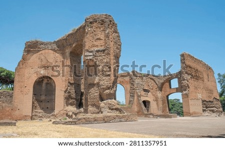 Massive ancient brick walls and soaring arches of the Baths of Caracalla in Rome, Italy, Europe