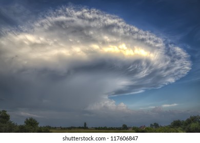 Massive Anvil Cloud Or Cumulonimbus Incus Oer A Villlage Landscape