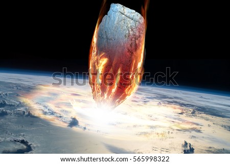 A massive asteroid enters Earth's atmosphere and impacts the planet causing an extinction level event. - Elements of this image furnished by NASA.