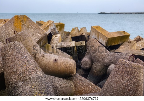 Massive\
concrete breakwaters on the Baltic Sea coast to protect the coast\
from the destructive effects of sea\
waves.