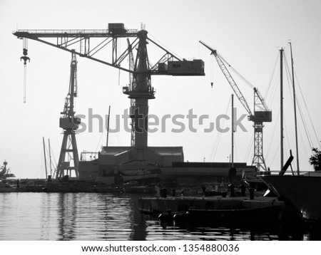 Similar – Pastel evening atmosphere at the harbor basin with cargo cranes