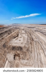 Massive deep open pit black coal mine in Hunter valley of Australia - aerial vertical panorama.