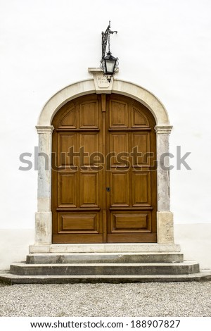 Massive entrance, wooden door of the castle.