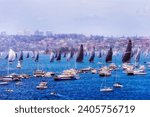 Massive flotilla of yachts boats and ships on Sydney harbour at start of Sydney Hobart Yacht race.