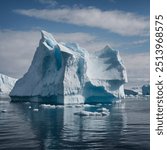 Massive icebergs are enormous chunks of ice that have broken off from glaciers or ice shelves and drift in the ocean. These towering ice formations, sometimes as large as cities, are primarily compose