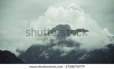 Massive Mountain Covered in Clouds