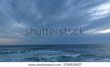 Massive Storm Clouds and Powerful Waves at Sunrise

A 4K seascape featuring massive tornado-like dark clouds spreading across the sky as if swallowing the ocean. Powerful waves crash onto the shore with creamy foam captured in motion. The storm clouds rise from the ocean surface into the sky, while golden and orange rays peek through, creating a dramatic scene where the clouds struggle to hide the rising sun.