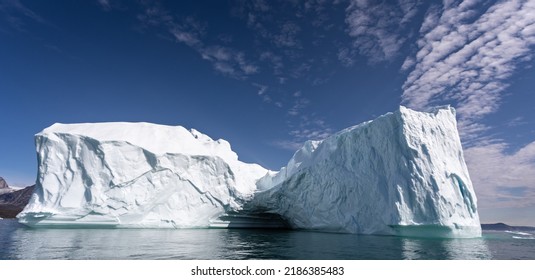 Massive towering iceberg off the Greenland coast in Disko Bay
