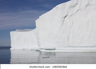 Massive, Towering Icebergs Drift And Melt In Disko Bay (western Greenland). Icebergs Make Up 50% Of The Mass Loss From The Greenland Ice Sheet