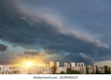 A massive, well-defined supercell storm cloud looms ominously over a city skyline, creating a dramatic and threatening atmospheric scene. Powerful weather.