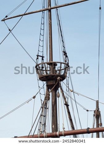 Mast, crow's nest and rigging on vintage Portuguese sailing ship