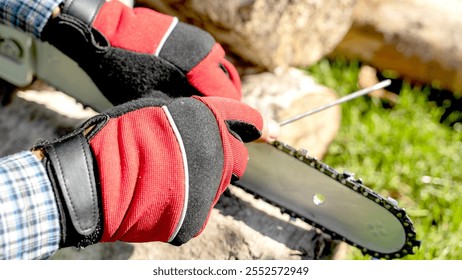 Maste on sharpening chains sharpens cap on a chainsaw - Powered by Shutterstock