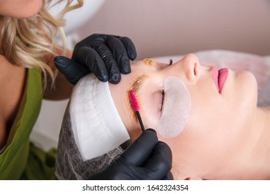 The Master Apply Scrub On Eyebrows With Brush For Prepare Them To Dyeing.