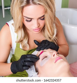 The Master Apply Scrub On Eyebrows With Brush For Prepare Them To Dyeing.