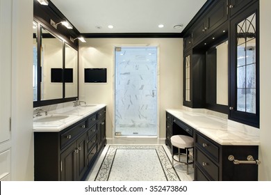 Master Bath In Luxury Home With Black Cabinetry