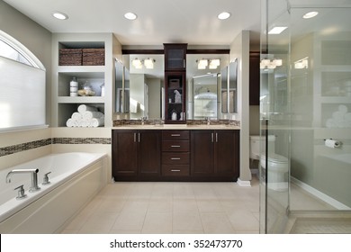Master Bath In Luxury Home With Dark Wood Cabinetry