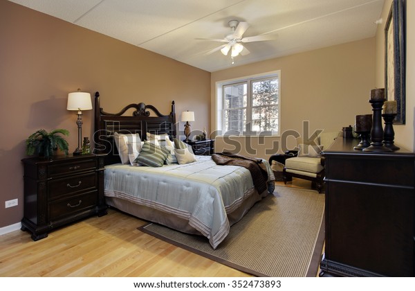 Master Bedroom Condominium Dark Wood Furniture Stock Photo