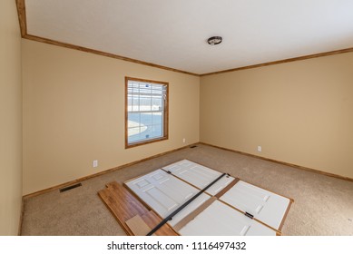 Master Bedroom In A Just-delivered New Manufactured Home.  Doors And Trim Are Attached To The Floor During Shipping.