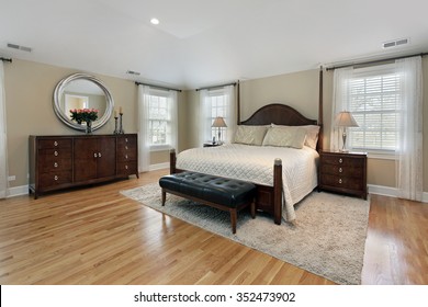 Master Bedroom In Luxury Home With Tray Ceiling