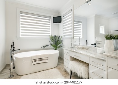 Master Bedroom With Walk In Closet And Large Ensuite Bathroom Tub Glass Shower Staged Closet 