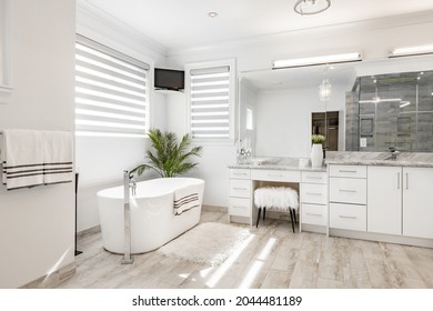 Master Bedroom With Walk In Closet And Large Ensuite Bathroom Tub Glass Shower Staged Closet 