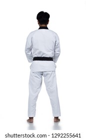 Master Black Belt TaeKwonDo Handsome Man Instructor Teacher Fighter Show Hit Pose, Studio Lighting White Background Isolated.  Karate Formal Fighting Suit, Motion Blur Hand Foots On Taekwondo Post.