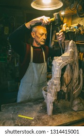 Master Carpenter 50 - 55 Years Old Creates Wooden Sculpture In The Workshop
